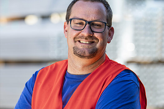 Herchenbach warehouse employee warmly smiling