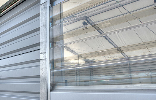 [Translucent panels in the wall cladding of a temporary building