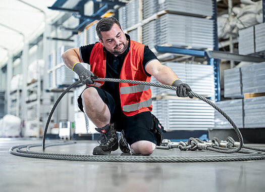Herchenbach employee examines tension cable