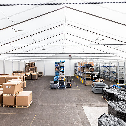 Temporary building with stored goods inside perspective